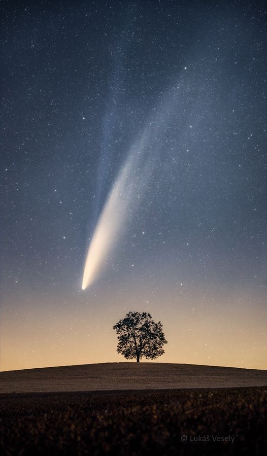 comet neowise over czech hills by lukas vesely